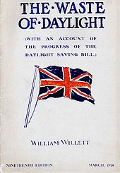 Pamphlet cover showing a large British flag in red, white, and dark blue, with the large title «THE WASTE OF DAYLIGHT», an unreadable subtitle, and «WILLIAM WILLETT» near the bottom.